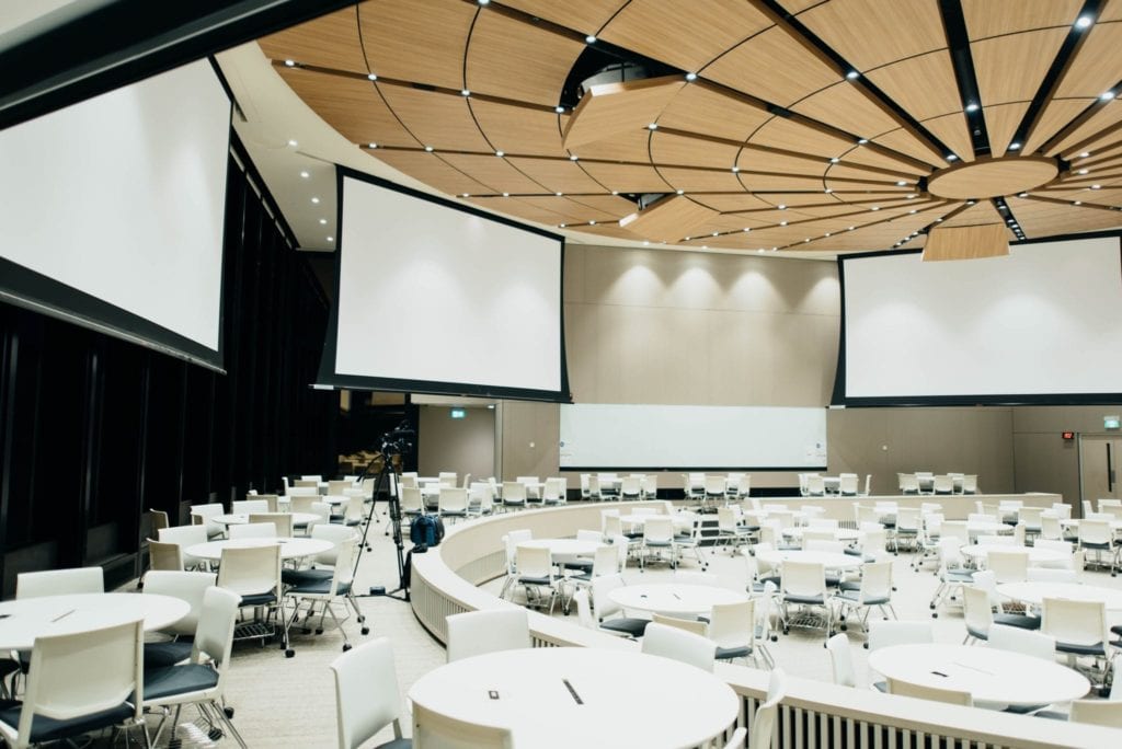 auditorium utilizing screens for cart services