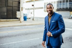 man poses for a picture for his veteran-owned businesses