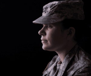 silhouette of a young woman in military uniform veteran-owned business