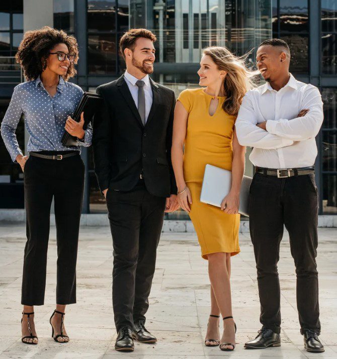 A group of people in office attire standing outside