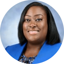 Smiling African American woman wearing blazer, headshot